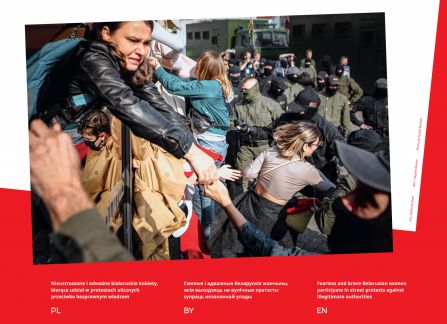 Photograph from the exhibition Belarus. road to freedom. crowd of demonstrators mixed with soldiers. the woman leans over the barricade.